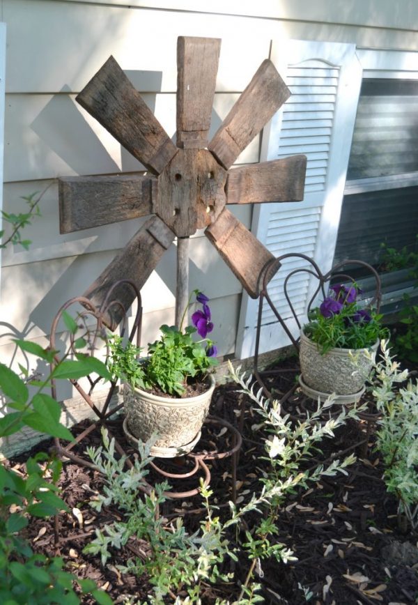 Yard Art Made From A Repurposed Broken Wood Barrel