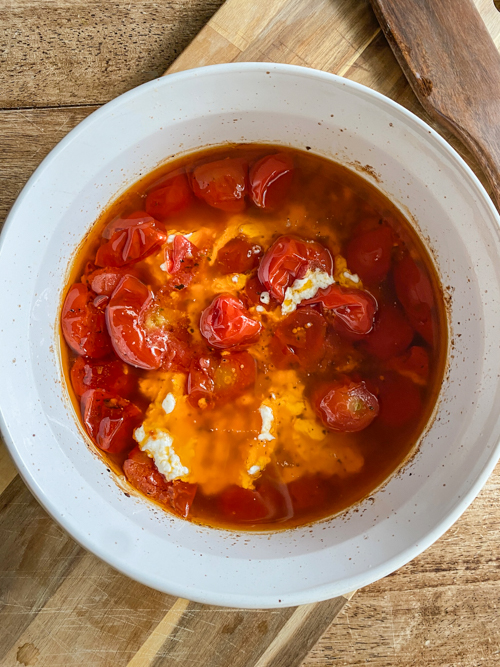 Enjoy summer's bounty with this Cherry Tomato and Burrata Appetizer Dip! Fresh tomatoes, creamy burrata, and crusty bread make the perfect tailgate or party dish.