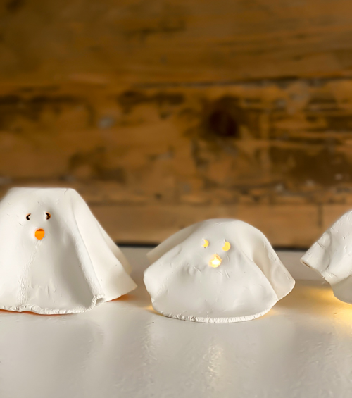 Create adorable DIY Clay Tea Light Ghosts for Halloween! Easy-to-make, spooky decor that glows with battery-operated lights. Perfect handmade charm for home!