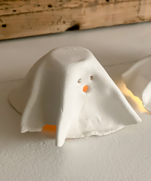 Create adorable DIY Clay Tea Light Ghosts for Halloween! Easy-to-make, spooky decor that glows with battery-operated lights. Perfect handmade charm for home!