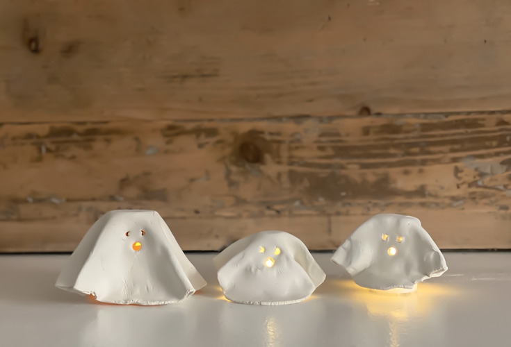 Create adorable DIY Clay Tea Light Ghosts for Halloween! Easy-to-make, spooky decor that glows with battery-operated lights. Perfect handmade charm for home!