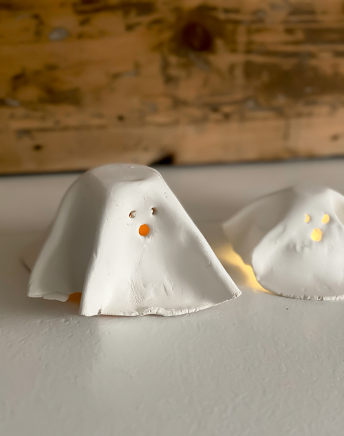 Create adorable DIY Clay Tea Light Ghosts for Halloween! Easy-to-make, spooky decor that glows with battery-operated lights. Perfect handmade charm for home!