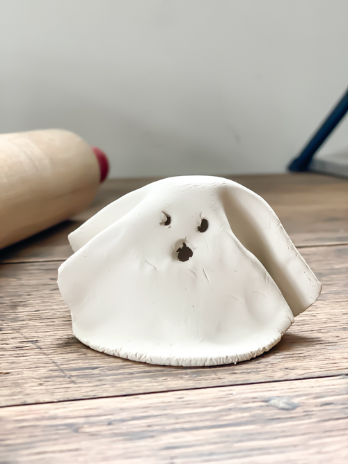 Create adorable DIY Clay Tea Light Ghosts for Halloween! Easy-to-make, spooky decor that glows with battery-operated lights. Perfect handmade charm for home!