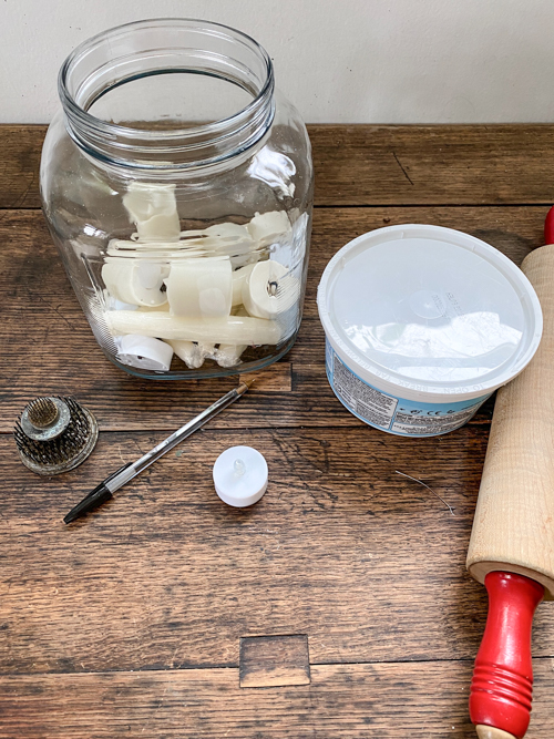 Create adorable DIY Clay Tea Light Ghosts for Halloween! Easy-to-make, spooky decor that glows with battery-operated lights. Perfect handmade charm for home!