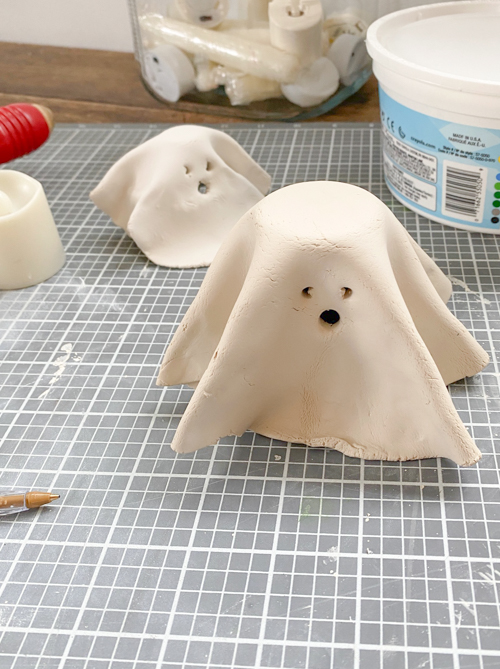 Create adorable DIY Clay Tea Light Ghosts for Halloween! Easy-to-make, spooky decor that glows with battery-operated lights. Perfect handmade charm for home!