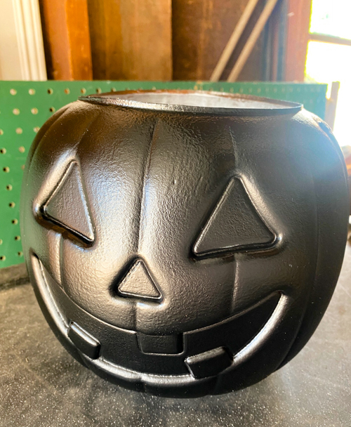 Create stylish Halloween decor with DIY Pottery Barn Jack-O-Lantern dupe. Get the high-end look for less than $5 using plastic pails, paint, and LED candles.