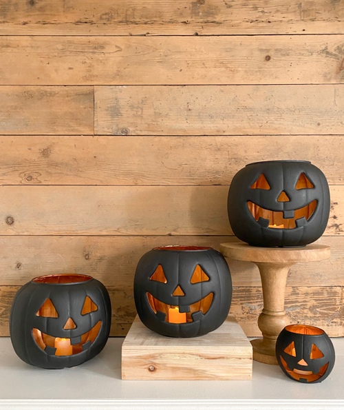 Create stylish Halloween decor with DIY Pottery Barn Jack-O-Lantern dupe. Get the high-end look for less than $5 using plastic pails, paint, and LED candles.