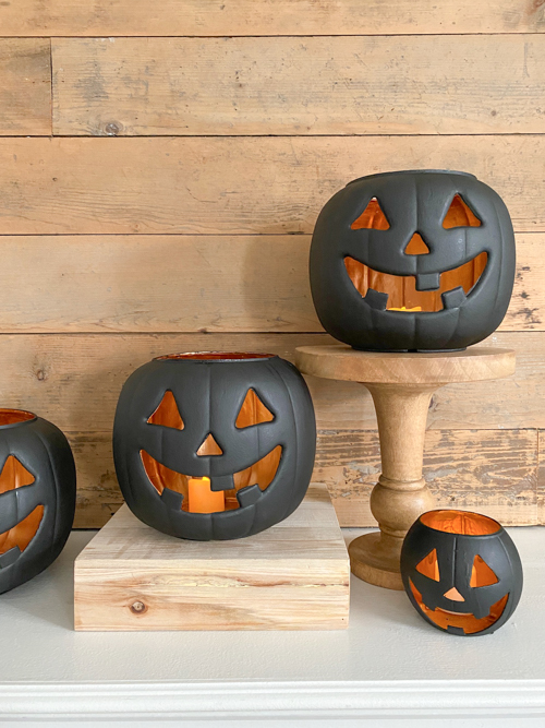 Create stylish Halloween decor with DIY Pottery Barn Jack-O-Lantern dupe. Get the high-end look for less than $5 using plastic pails, paint, and LED candles.