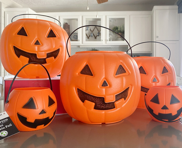 Create stylish Halloween decor with DIY Pottery Barn Jack-O-Lantern dupe. Get the high-end look for less than $5 using plastic pails, paint, and LED candles.