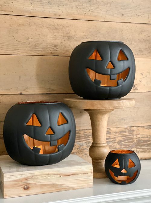 Create stylish Halloween decor with DIY Pottery Barn Jack-O-Lantern dupe. Get the high-end look for less than $5 using plastic pails, paint, and LED candles.