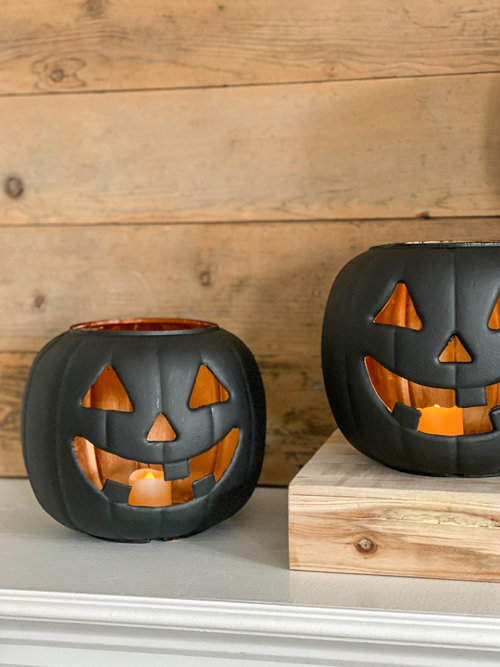 Create stylish Halloween decor with DIY Pottery Barn Jack-O-Lantern dupe. Get the high-end look for less than $5 using plastic pails, paint, and LED candles.