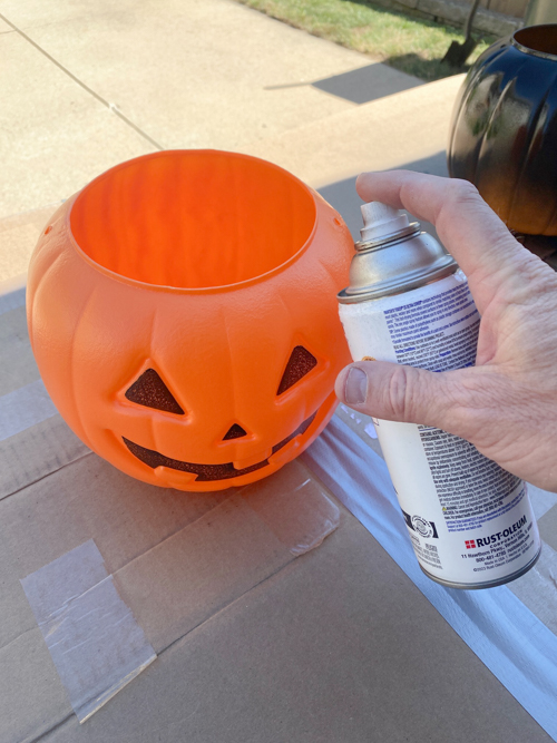 Create stylish Halloween decor with DIY Pottery Barn Jack-O-Lantern dupe. Get the high-end look for less than $5 using plastic pails, paint, and LED candles.