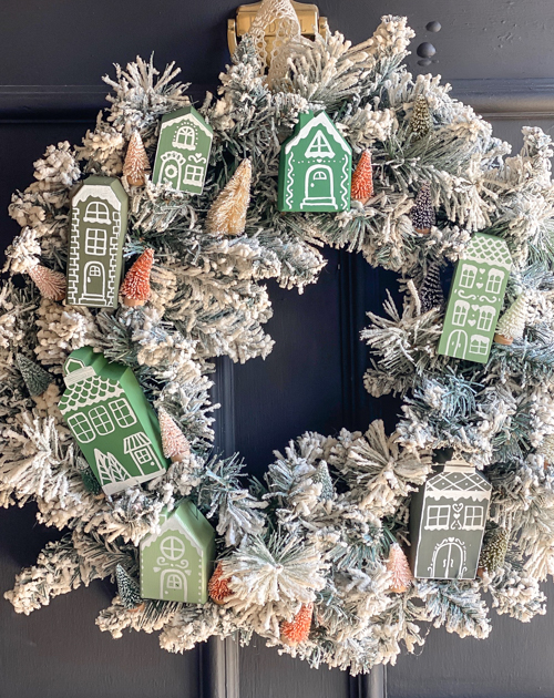 Create a festive DIY Christmas village wreath with thrifted items! This budget-friendly project adds a charming, personalized touch to your holiday decor.