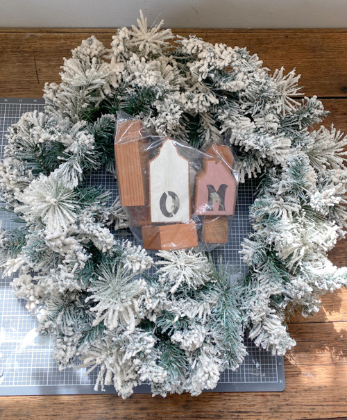 Create a festive DIY Christmas village wreath with thrifted items! This budget-friendly project adds a charming, personalized touch to your holiday decor.