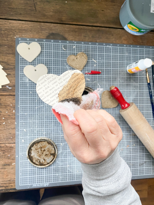 Create a charming DIY Heart Garland using air dry clay, book pages, and stain. This easy craft adds a vintage touch to your home decor for any season.