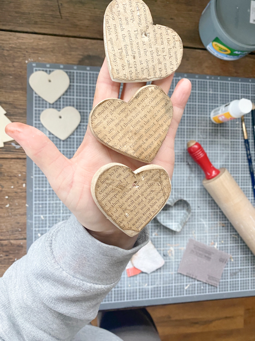 Create a charming DIY Heart Garland using air dry clay, book pages, and stain. This easy craft adds a vintage touch to your home decor for any season.