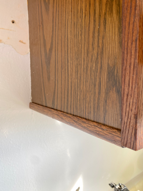 Fix chipping cabinet edges with trim for a quick, budget-friendly update. Learn how this easy DIY can save you thousands and refresh your kitchen cabinets.